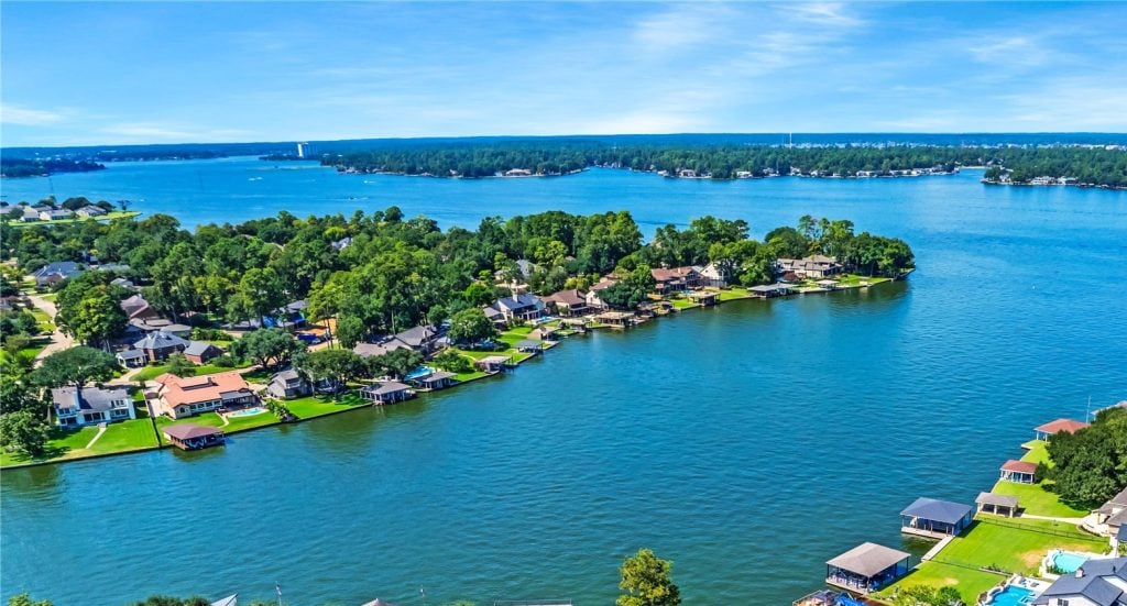 | the mckellar group a Vibrant Drone Shot of a Lake Conroe Neighborhood Along the Water