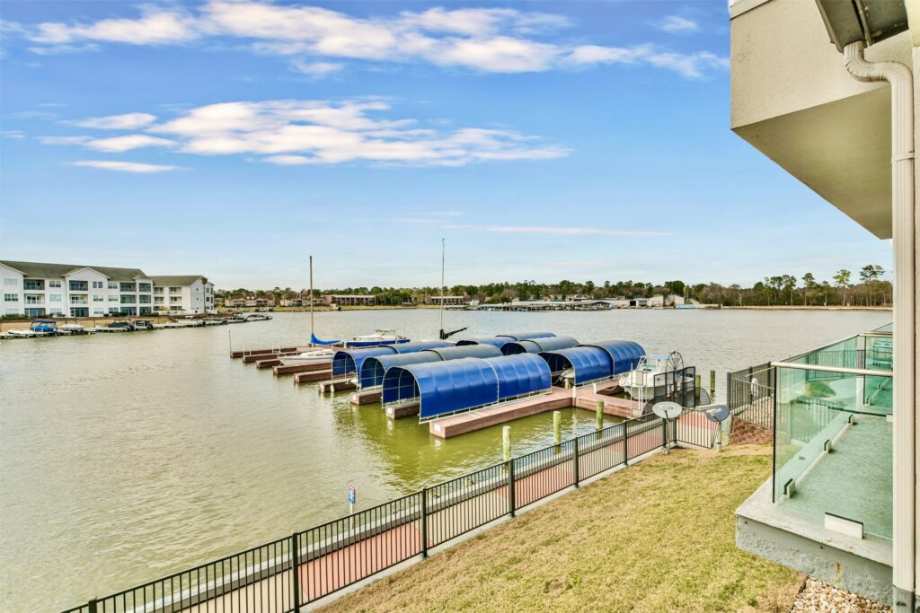 32 dsc 3584edit | the mckellar group Wide Shot of Boat Slips by Lake Conroe Condos