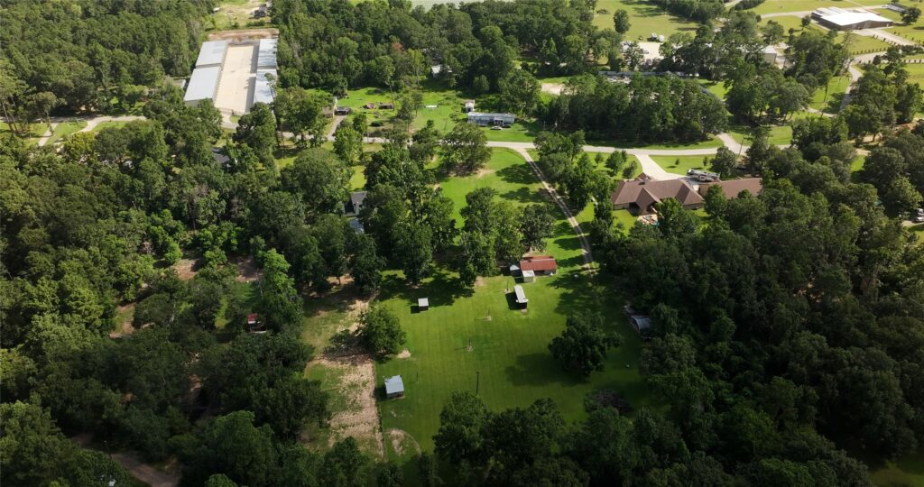 | the mckellar group Wide Shot from Above of an Off water Neighborhood Home in the Lake Conroe Area