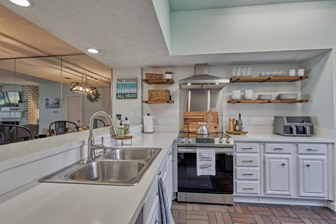 | the mckellar group Inside of a Modern Lake House Kitchen with Life on the Lake Themed Decor