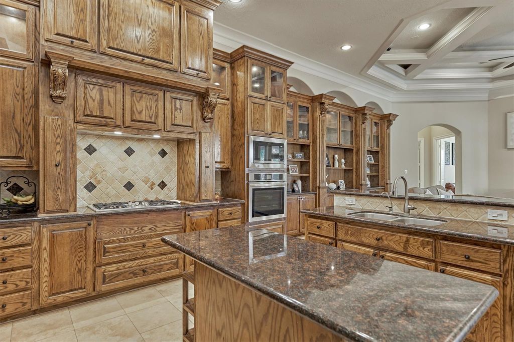 755979872 | the mckellar group Large Traditional Kitchen with Extensive Oak Cabinetry Granite Island and Built in Double Ovens