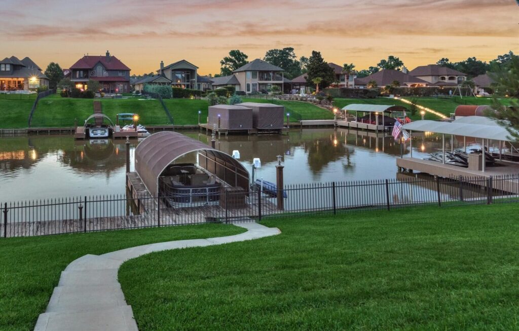 | the mckellar group Sunset over a Suburban Canal Community with Houses Boats and Well kept Lawns